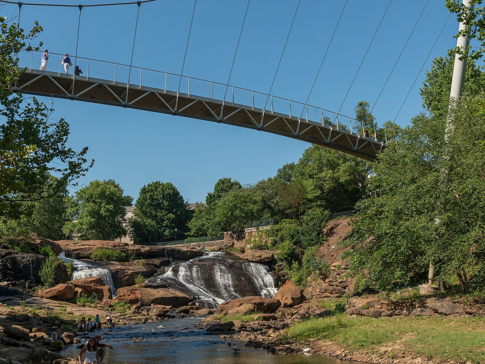 The Liberty Bridge suspension footbridge over the falls at Falls Park in downtown Greenville, South Carolina