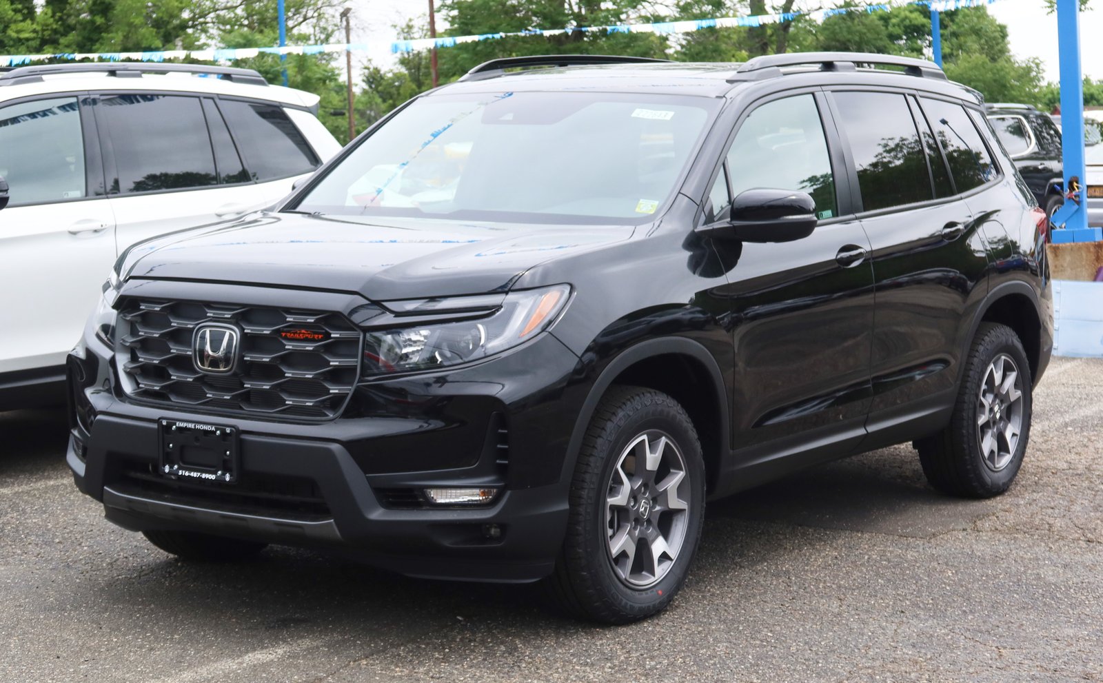 2022 Honda Passport TrailSport in white, front three-quarter view